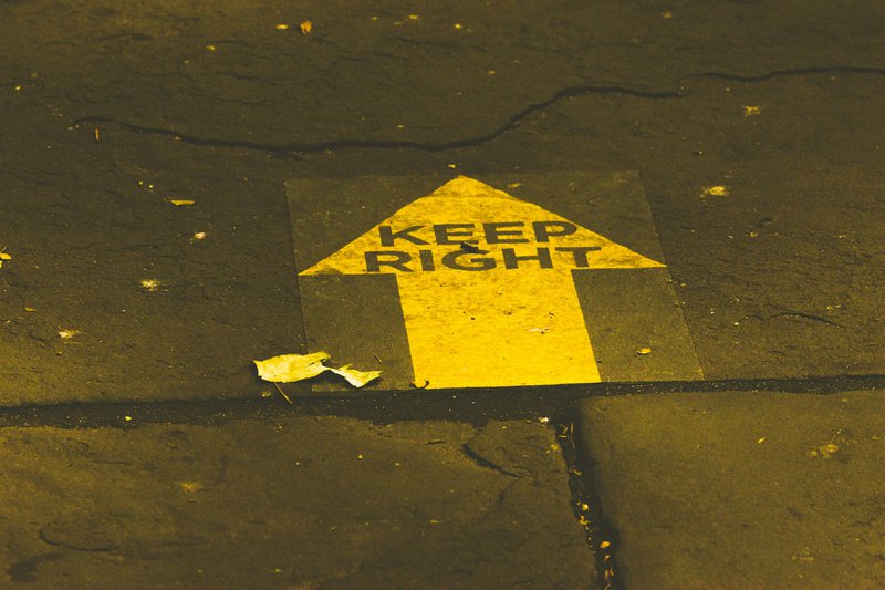 yellow and black road sign