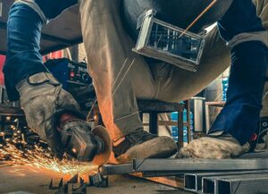 a man working on a piece of metal