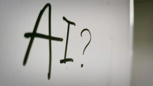 a sign with a question mark and a question mark drawn on it