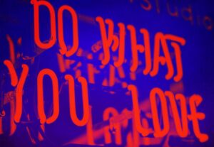 greyscale photo of DO What YOu Love signage