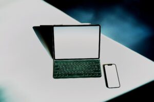 a tablet and a cell phone sitting on a table