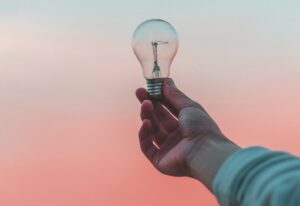 person holding light bulb