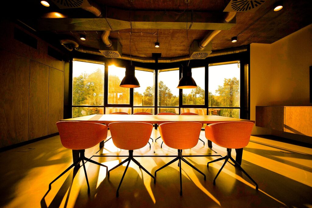 pink dining table with four chairs inside room