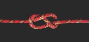 white and red rope on black background