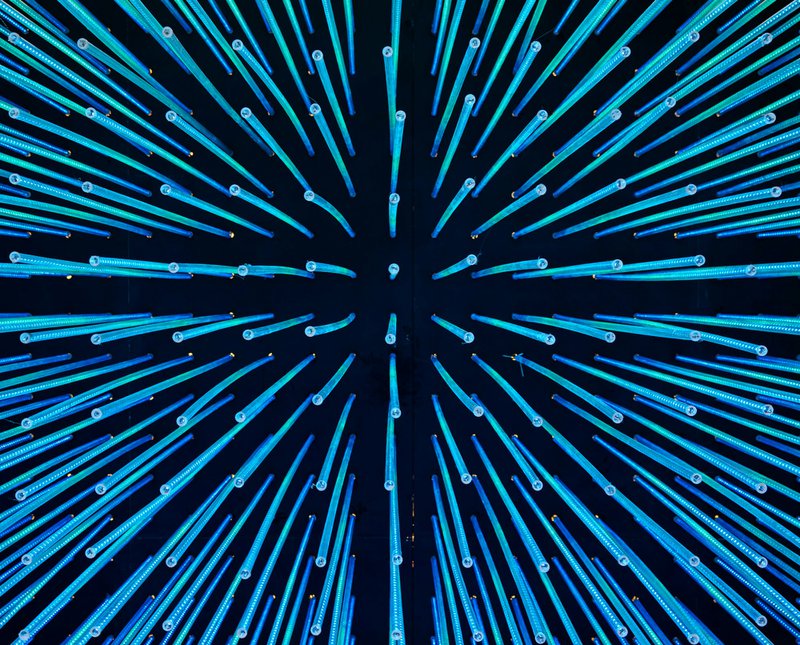 Abstract blue lines radiating from a central point