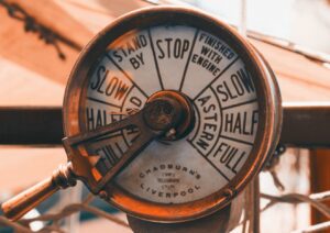 a close up of a clock on a pole