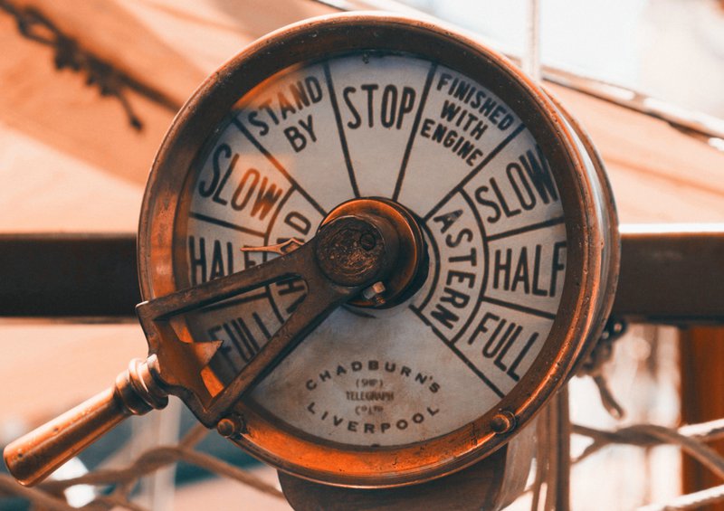 a close up of a clock on a pole