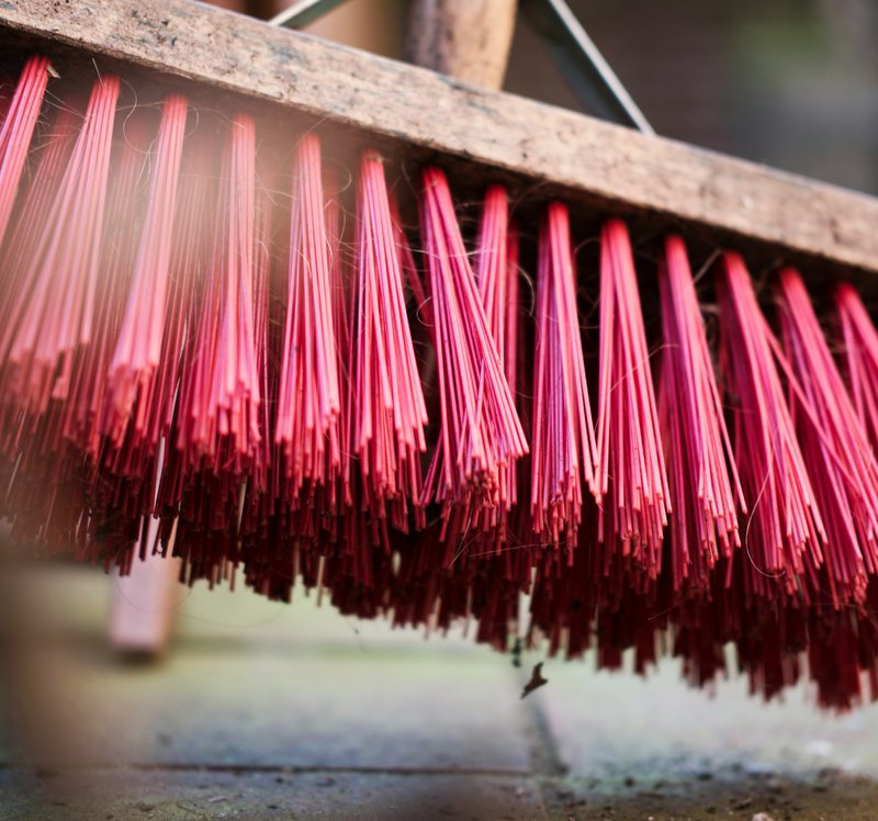 red and brown brush on white wooden table