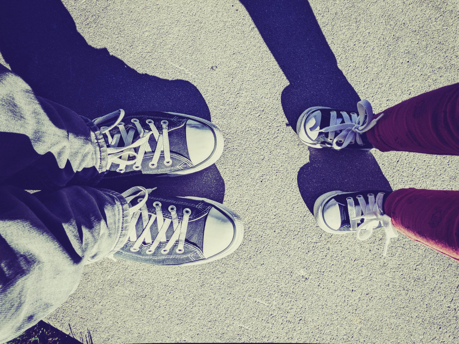 a pair of feet standing next to each other