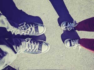 a pair of feet standing next to each other