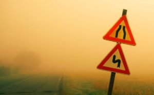 road signs covered with mist