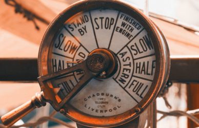 a close up of a clock on a pole