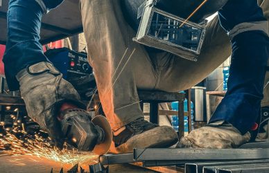 a man working on a piece of metal