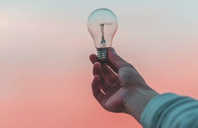 person holding light bulb