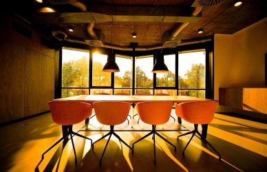 pink dining table with four chairs inside room