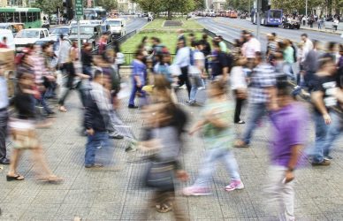 timelapse photo of people passing the street